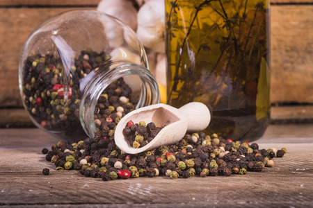 Colored pepper on a wooden background.