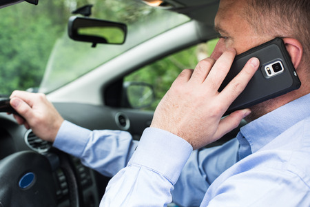 Man talking on the phone while driving