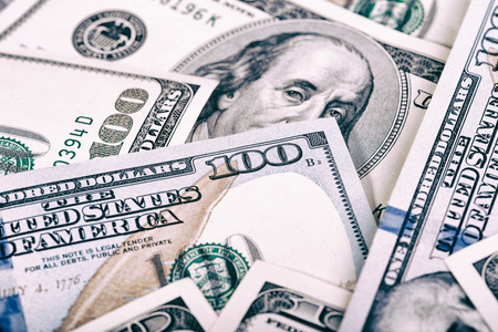 The US currency. Dollars related eraser on a wooden board.Background of success