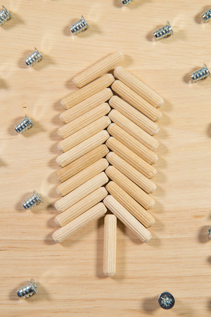 Elements of fastening pieces of furniture on a wooden background.の写真素材