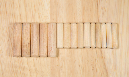 Elements of fastening pieces of furniture on a wooden background.の写真素材