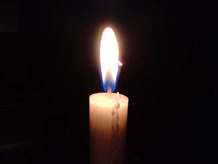 Candle light in a black backgroundの写真素材