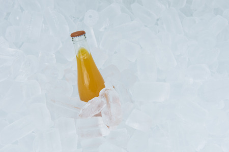 Orange Juice Bottle On Ice Boxの写真素材