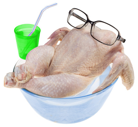 fresh raw chicken relaxes in hot tub with cocktail isolated on white backgroundの写真素材