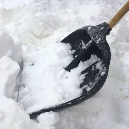 black plastic shovel for snow removal, snowdriftの写真素材
