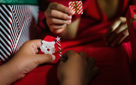 Kids Playing origami paper santa. Christmas Concept.の写真素材