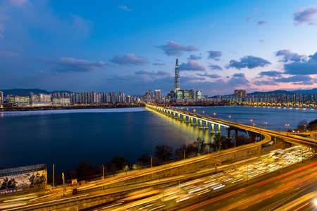 Skyscrapers in Asian South Korea Capital Seoul City with flashing lights and Car Traffic. in South Korea.の写真素材