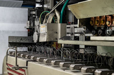 Spring blocking machine for making mattresses