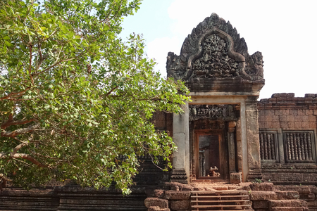 Wall of Bayon Temple at Angkor Thom.  Front Tree view of the Angkor Thom North Gate at the Angkor Temple complex  in a summer day near Siem Reap, Cambodia.の写真素材