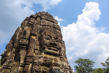 Stone Face on Bayon Temple at Angkor Thom, Buddhist faces on towers at Bayon Temple and mysterious temples of ancient civilisation, Siemreap, Cambodia.の写真素材