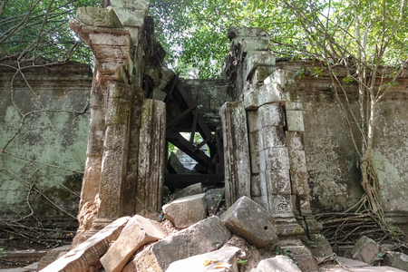Outside the wall of the collapsed door of Bayon Temple at Angkor Thom.  On top view of the Angkor Thom within the temple area at the Angkor Temple complex  in a summer day near Siem Reap, Cambodia.の写真素材