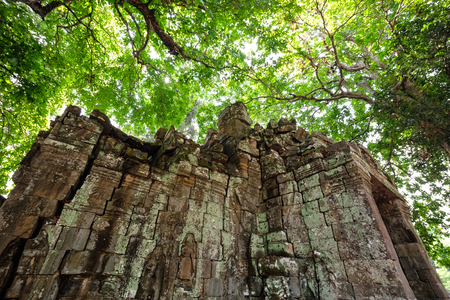 Old small castle covered with boiled wood of Bayon Temple at Angkor Thom.  On top view of the Angkor Thom within the temple area at the Angkor Temple complex  in a summer day near Siem Reap, Cambodia.の写真素材
