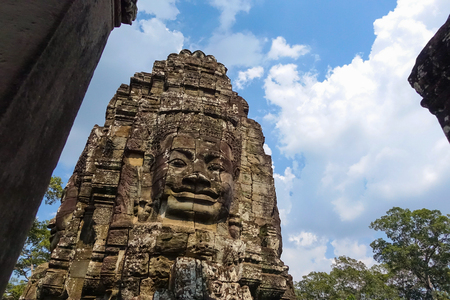 Stone Face on Bayon Temple at Angkor Thom, Buddhist faces on towers at Bayon Temple and mysterious temples of ancient civilisation, Siemreap, Cambodia.の写真素材