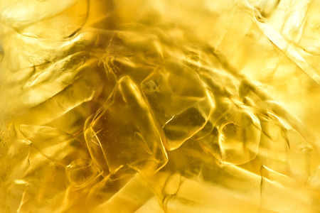 Close up glass of whiskey and iceの写真素材