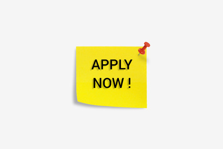 Yellow sticky note with message word ''Apply now'' opportunity recruitment isolated on white background.の写真素材
