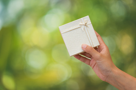 Hands holding give a special gift to someone.