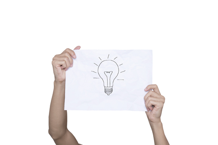 hand holding paper inspiration concept crumpled paper light bulb metaphor for good idea creative designの写真素材