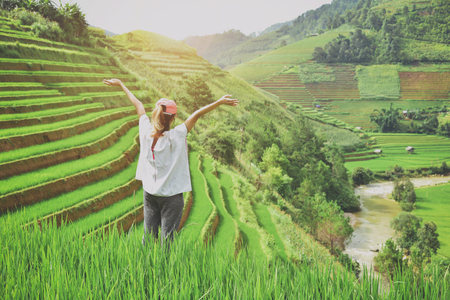 backpacker with valley rice terraces of a mountain at sapa vietnam.の写真素材