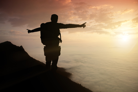 silhouette adventurer team on the mountain and sunrise. concept business successの写真素材