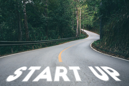 Startup to success business printed on road leading towards future concept.の写真素材