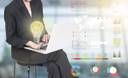 Business women hand holding light bulb, concept of new ideas with innovation and creativity.の写真素材