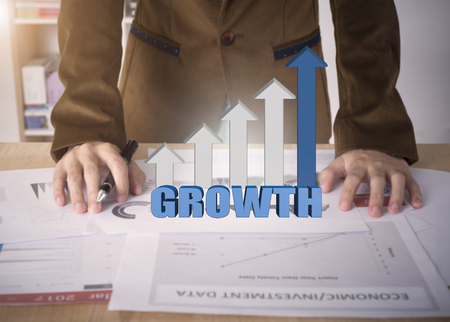 Business worker with graph growth on desk office. concept analysis finance.