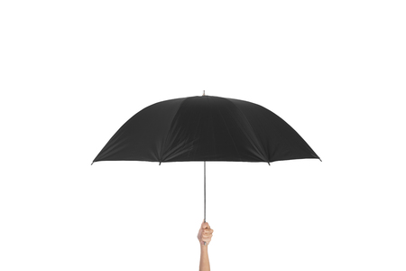 hand holding black umbrella isolated on white background.の写真素材