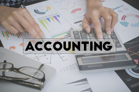 business accounting with document graph financial and calculator on office table. concept planning budget and audit.の写真素材