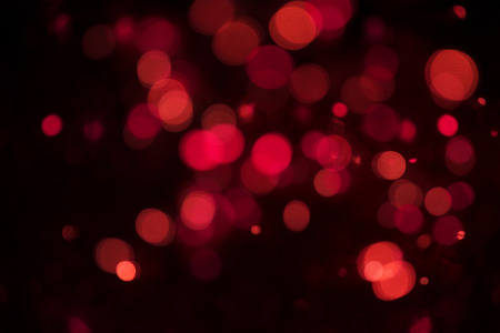 Abstract red glitter bokeh. concept christmas and new year for background.の写真素材