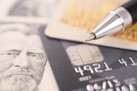 pen with credit card and dollar money. concept business economy finance.の写真素材