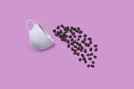 creative idea white coffee cup with coffee bean on pink background.の写真素材