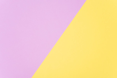Flat lay, pink and yellow paper pastel colors for texture background.の写真素材