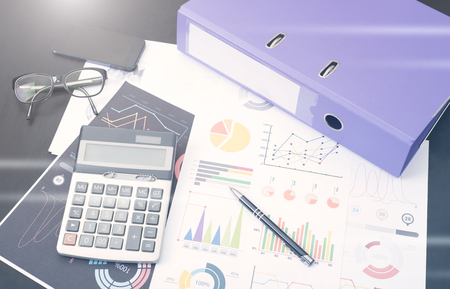 document graph financial with calculator on desk. concept planning budget and audit.の写真素材