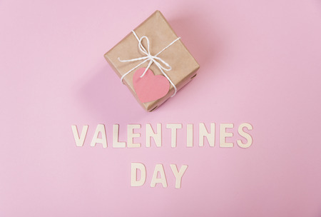 gift box and red heart with valentines day word on pink background.の写真素材