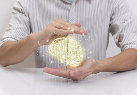 hand prevent brain, concept teamwork ideas with innovation and creativity.の写真素材