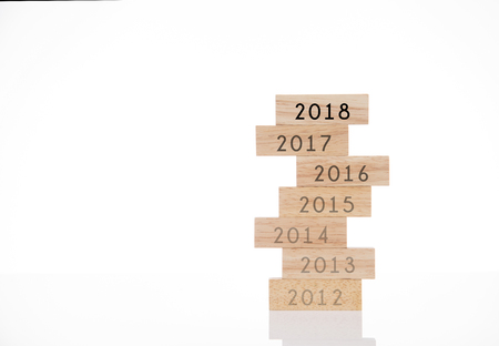 wooden blocks with new year 2018 replace 2017 concept isolated on white background.