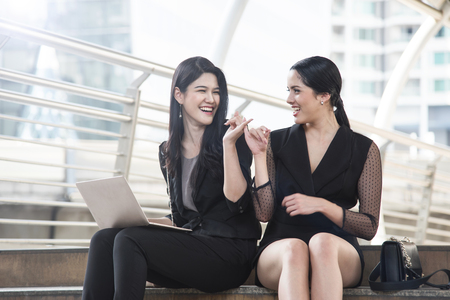 businesswoman showing hand finger for promise or friendship.の写真素材