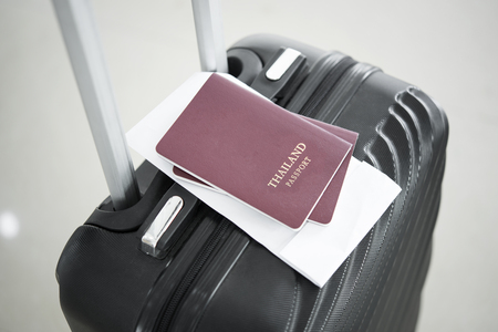 Thailand passport on black suitcase. concept travel and tourism.の写真素材
