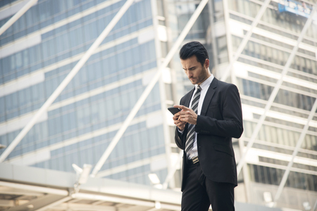 Handsome businessman using mobile phone. concept communication.の写真素材