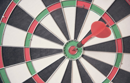 red arrow target center of dartboard. concept business goal to marketing success.の写真素材
