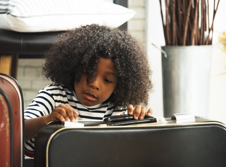african child playing toy in the living room.の写真素材
