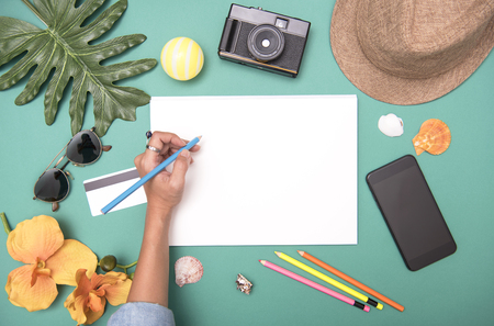 Mockup Black paper flat lay and traveler accessories around. Top view travel or vacation concept. Summer background.の写真素材