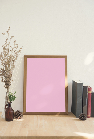 Blank white Photo Frame on Wooden for Design Mockup Template.の写真素材