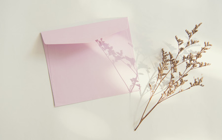 Blank white greeting card with flower. for mockup template. vintage tone.の写真素材