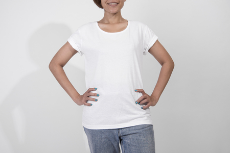 young woman in blank white t-shirt, shirt front. mockup template advertising and branding background.の写真素材