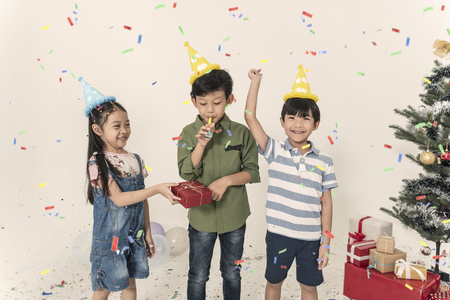 Group of kids celebrate christmas and happy new year party together.の写真素材