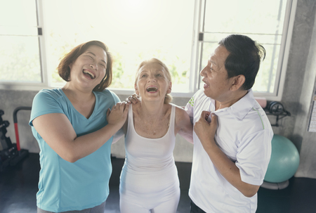 Group friend of senior at yoga gym smiling and happy. elderly healthy lifestyle.の写真素材