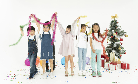 Group of kids celebrate christmas and happy new year party together.の写真素材