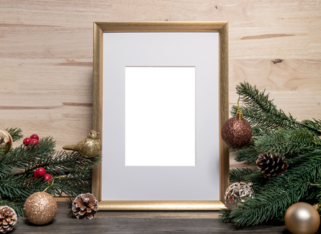 Christmas holiday greeting frame design mockup with decoration on wood table.の写真素材
