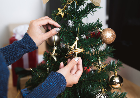 women decorate Christmas tree in Christmas day and happy new year.の写真素材